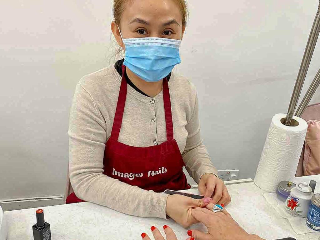 woman nail technician at work